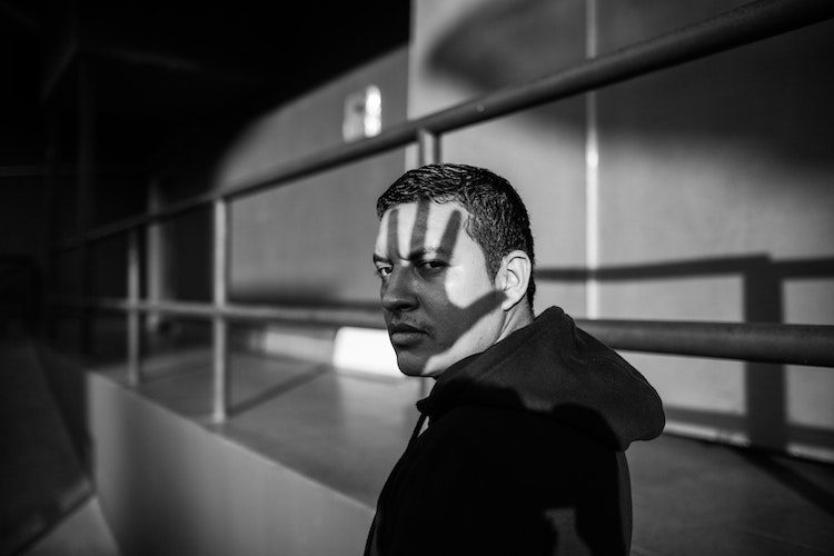 black and white photo man shadows stigma